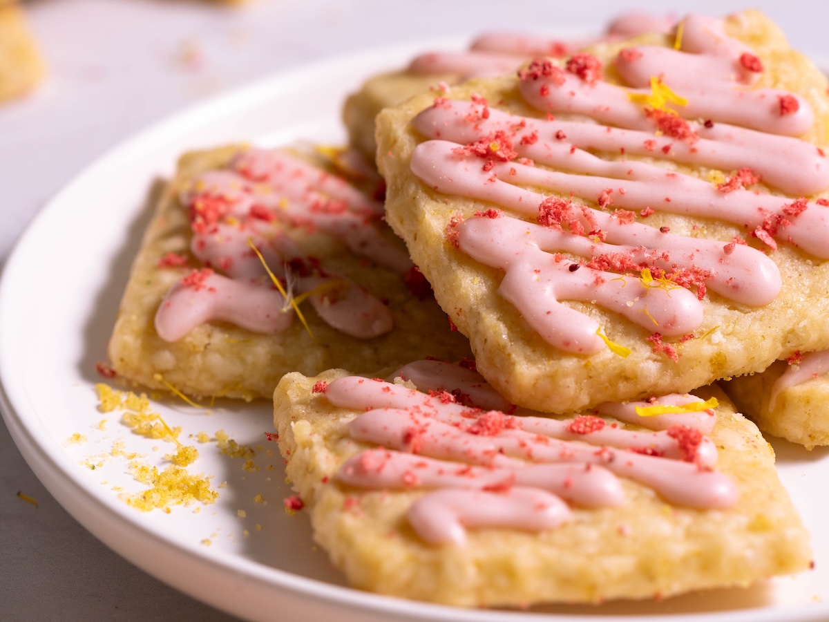 Dandelion & strawberry shortbread cookies on a plate