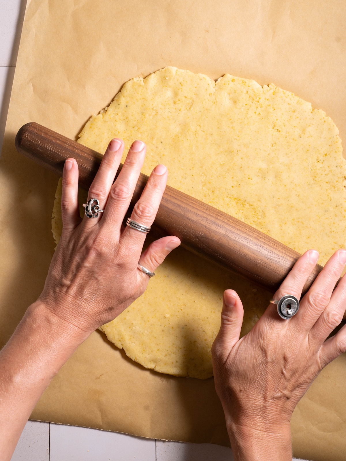 Rolling out cookie dough with a rolling pin
