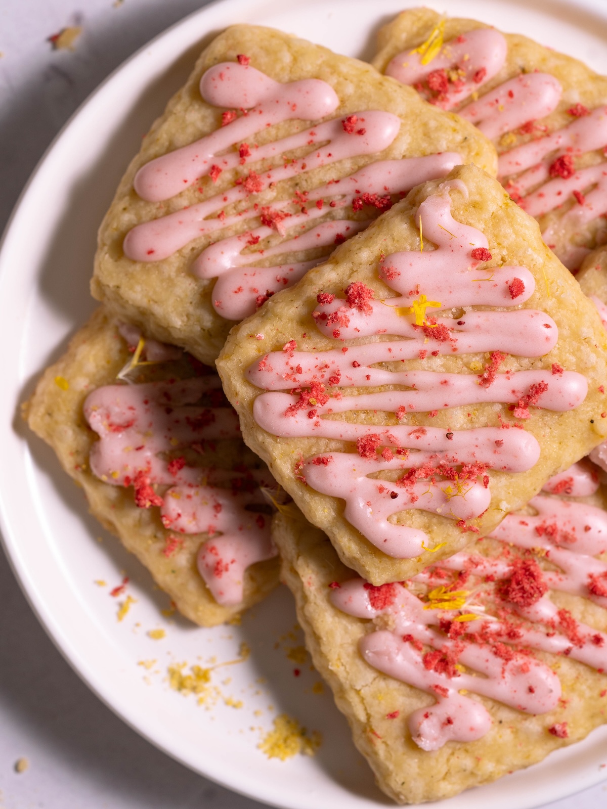 A pile of dandelion cookies on a plate