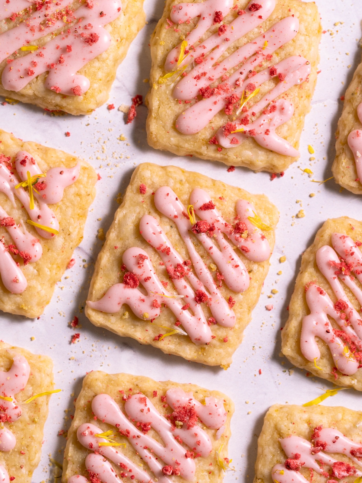 Dandelion shortbread cookies drizzled with strawberry glaze