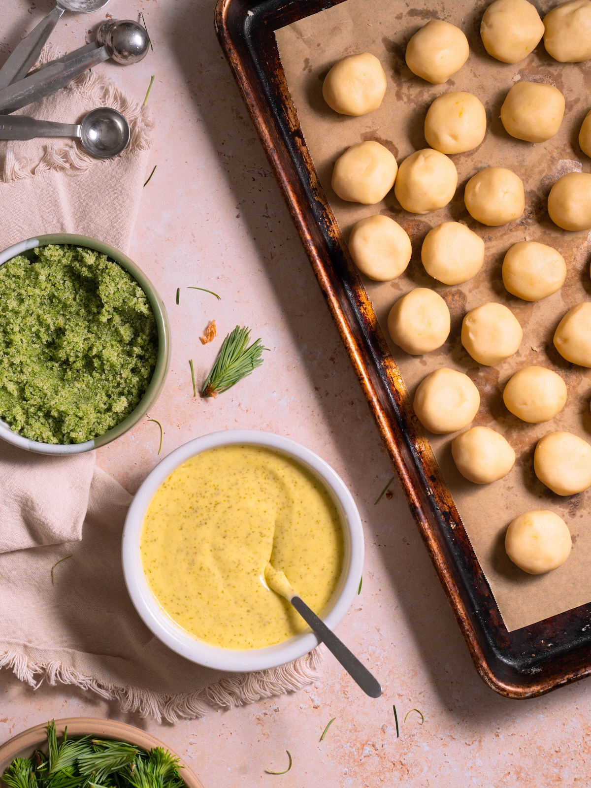 Cookie dough balls, fir tip sugar, and a bowl of lemon curd