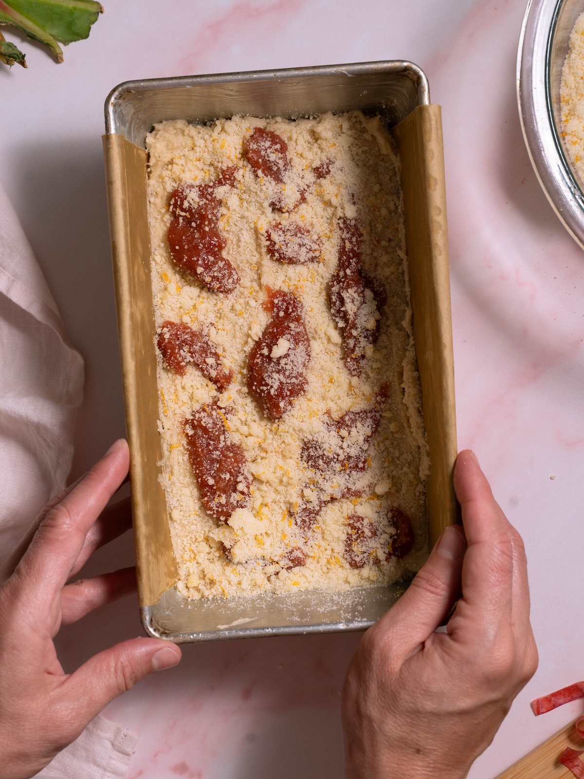 Layers of cake batter, rhubarb compote, and orange streusel