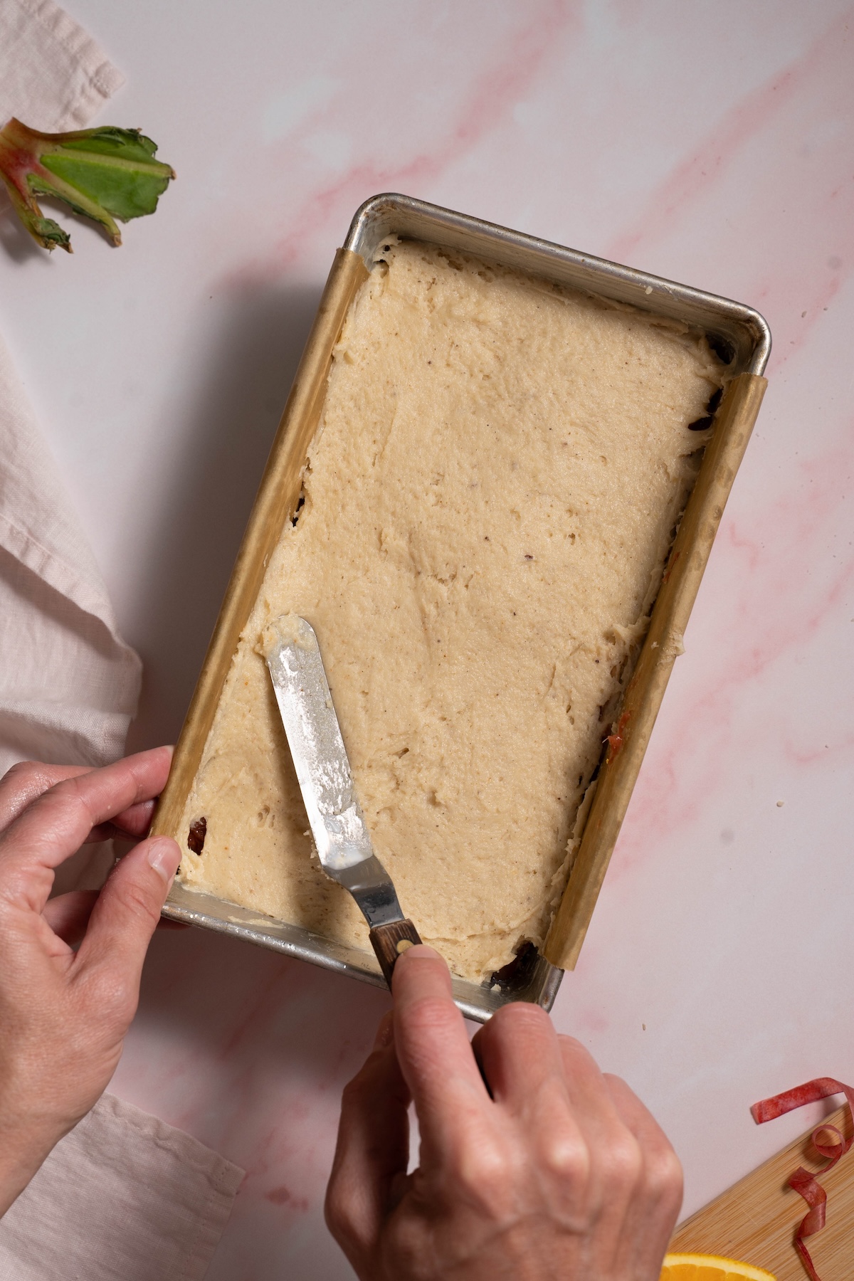 Spreading cake batter in a loaf pan