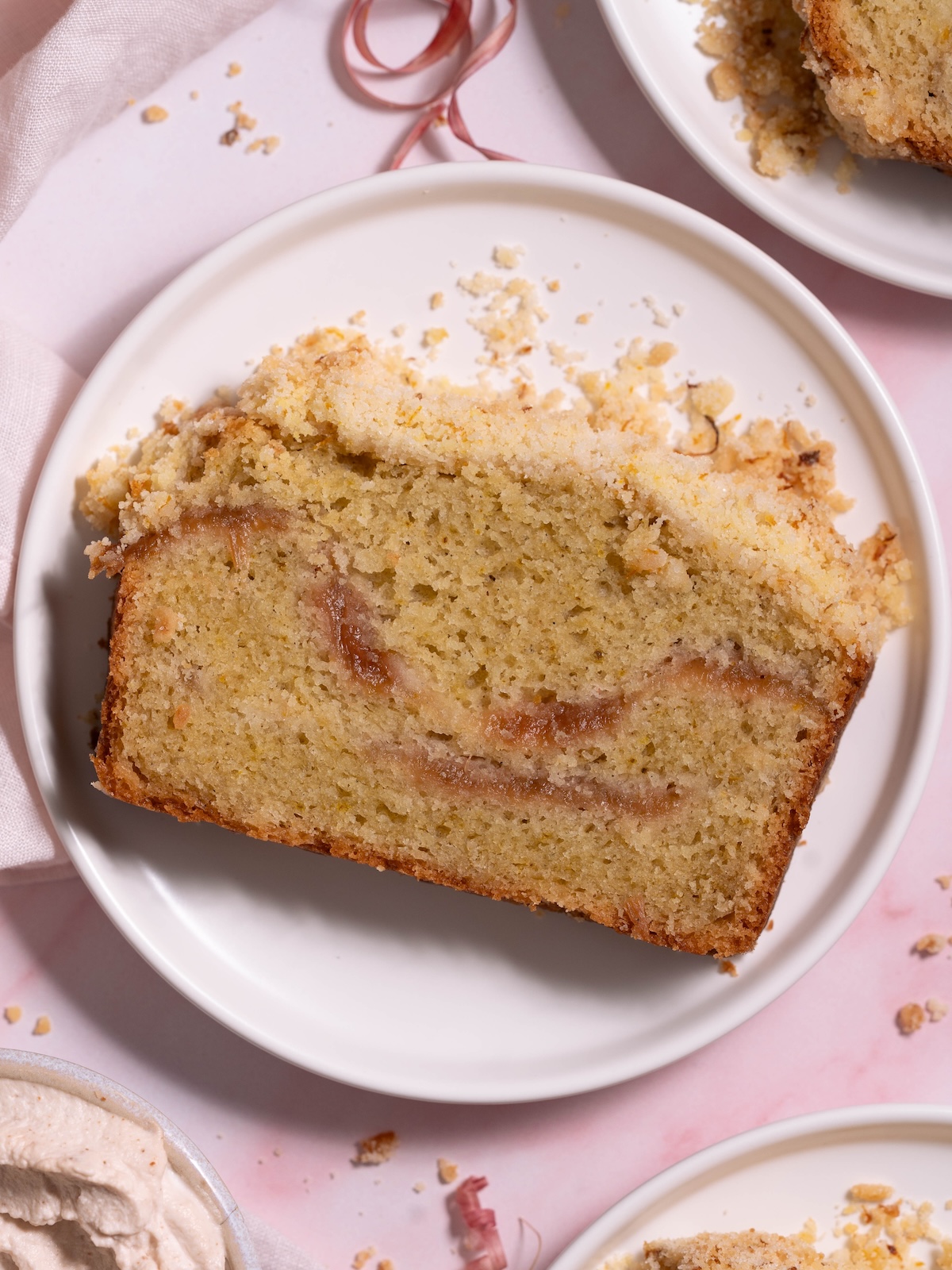 A slice of rhubarb crumble cake on a plate