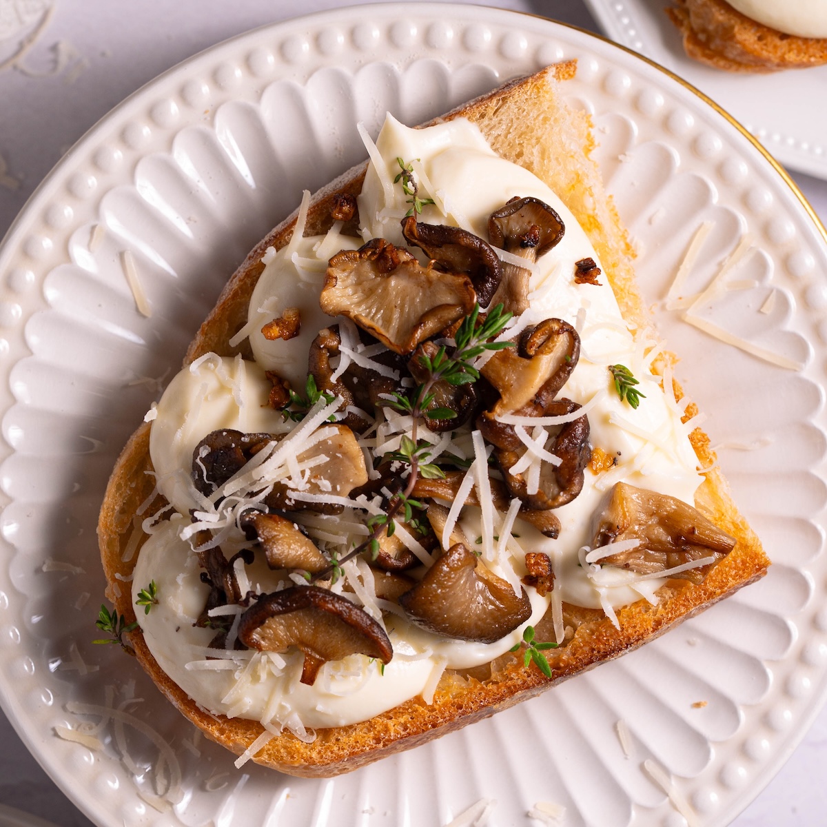 Crispy garlic mushrooms on top of ricotta and sourdough toast