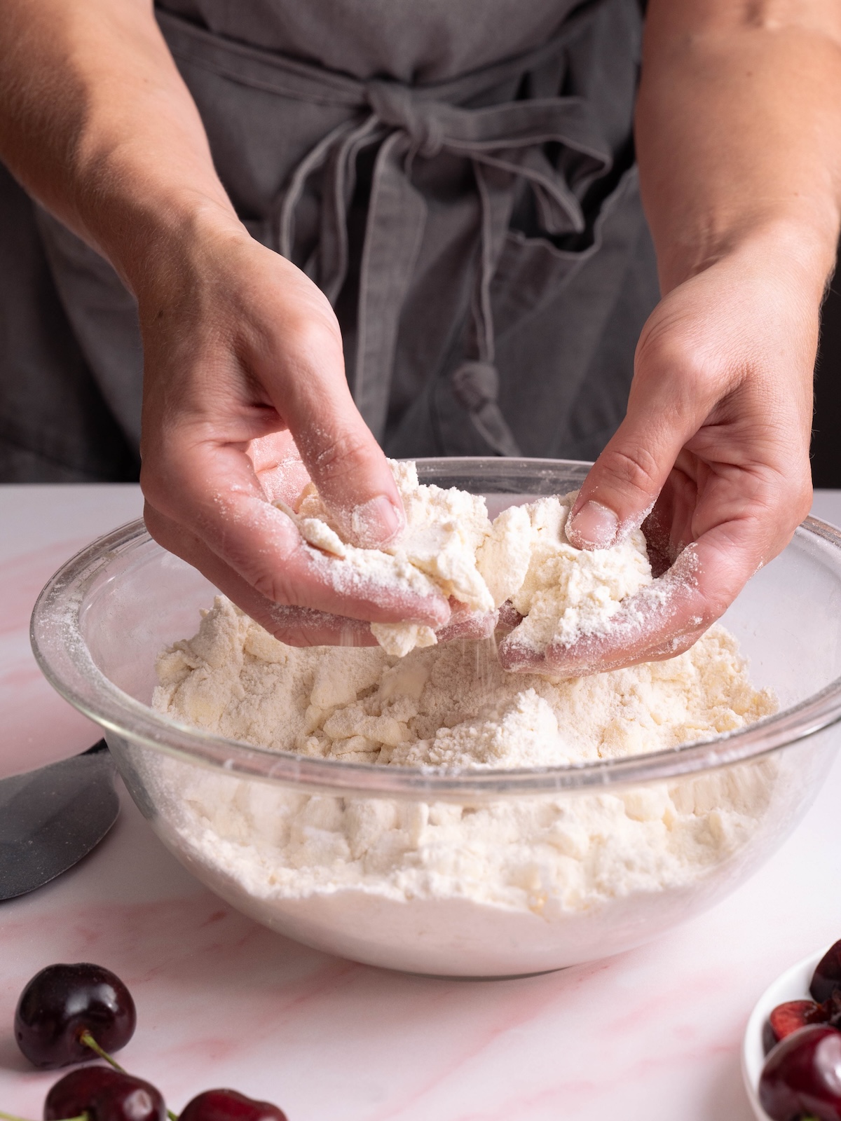 Blending butter into flour mixture with hands