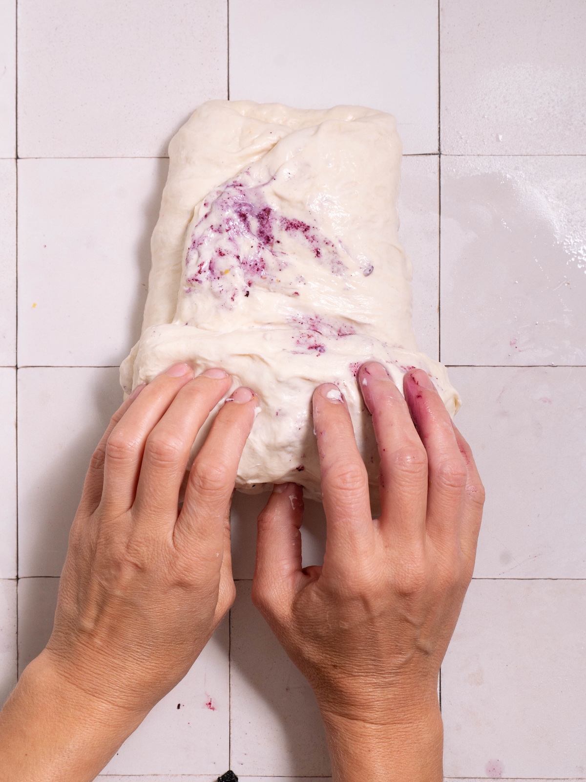 Rolling laminated sourdough into a rough ball