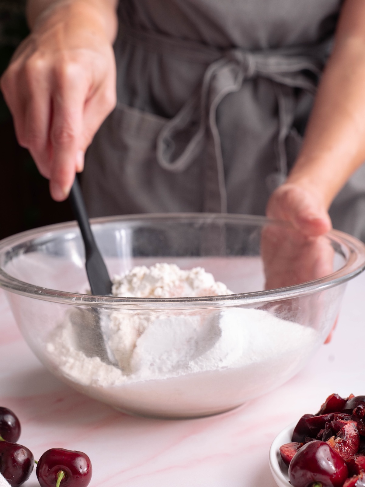 Stirring dry ingredients together in a mixing bowl