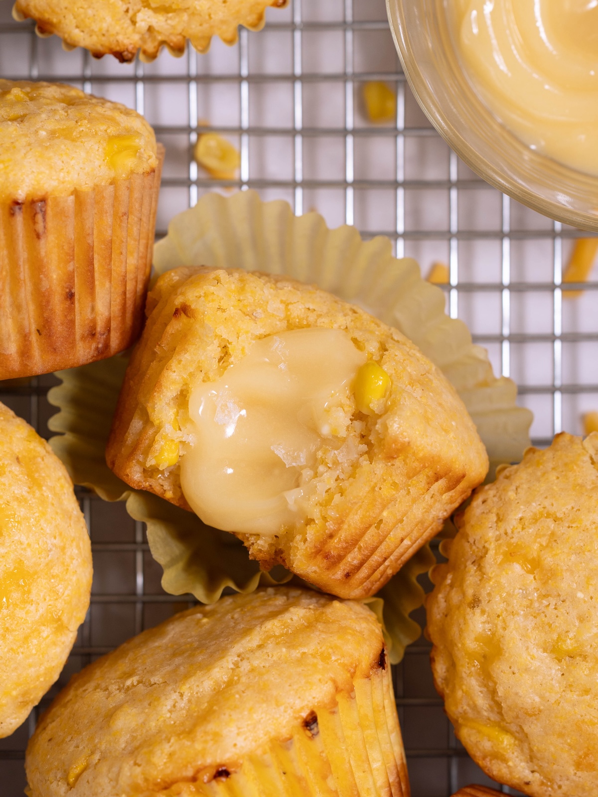 Corn muffins and a small bowl of whipped honey butter