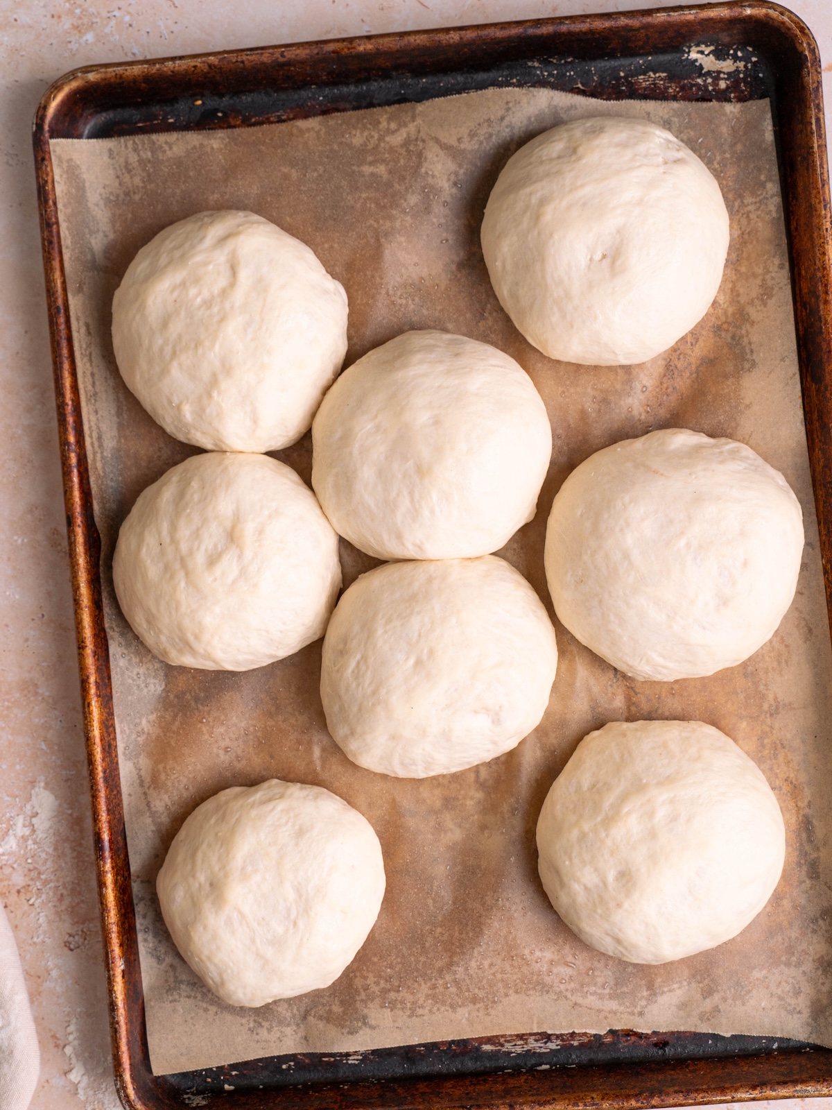 Balls of naan dough after rising