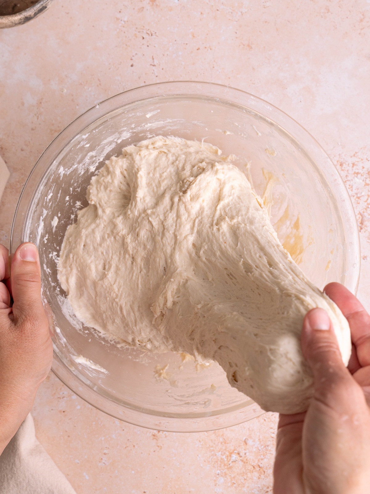 Stretching naan dough by hand