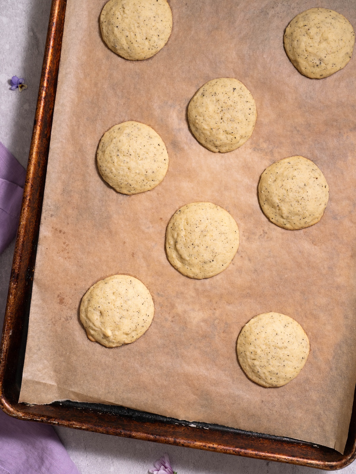Earl grey sugar cookies on a baking sheet, fresh out of the oven