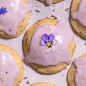 Lavender-glazed earl grey cookies, decorated with purple edible flowers