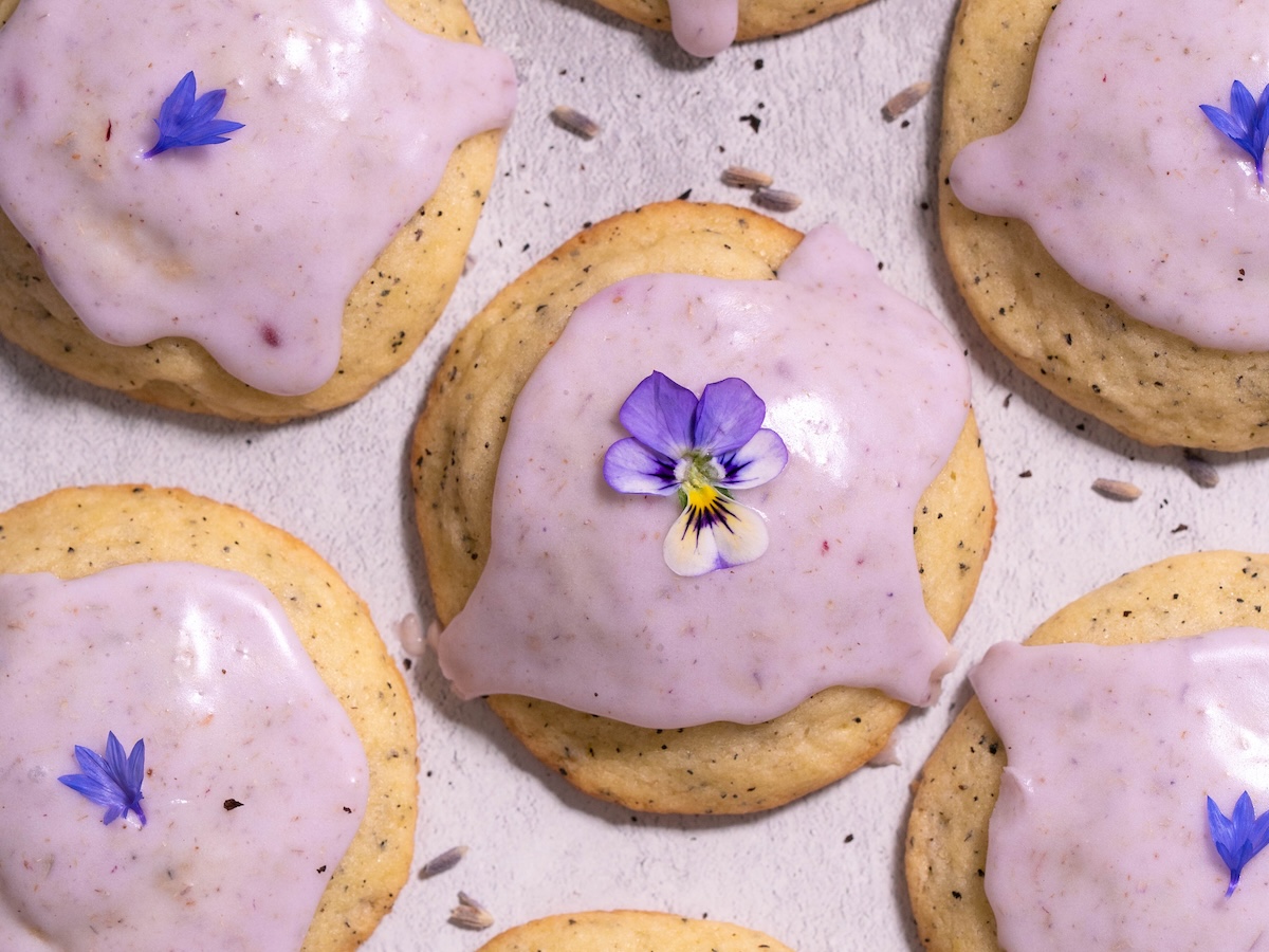 Lavender-glazed earl grey cookies, decorated with purple edible flowers