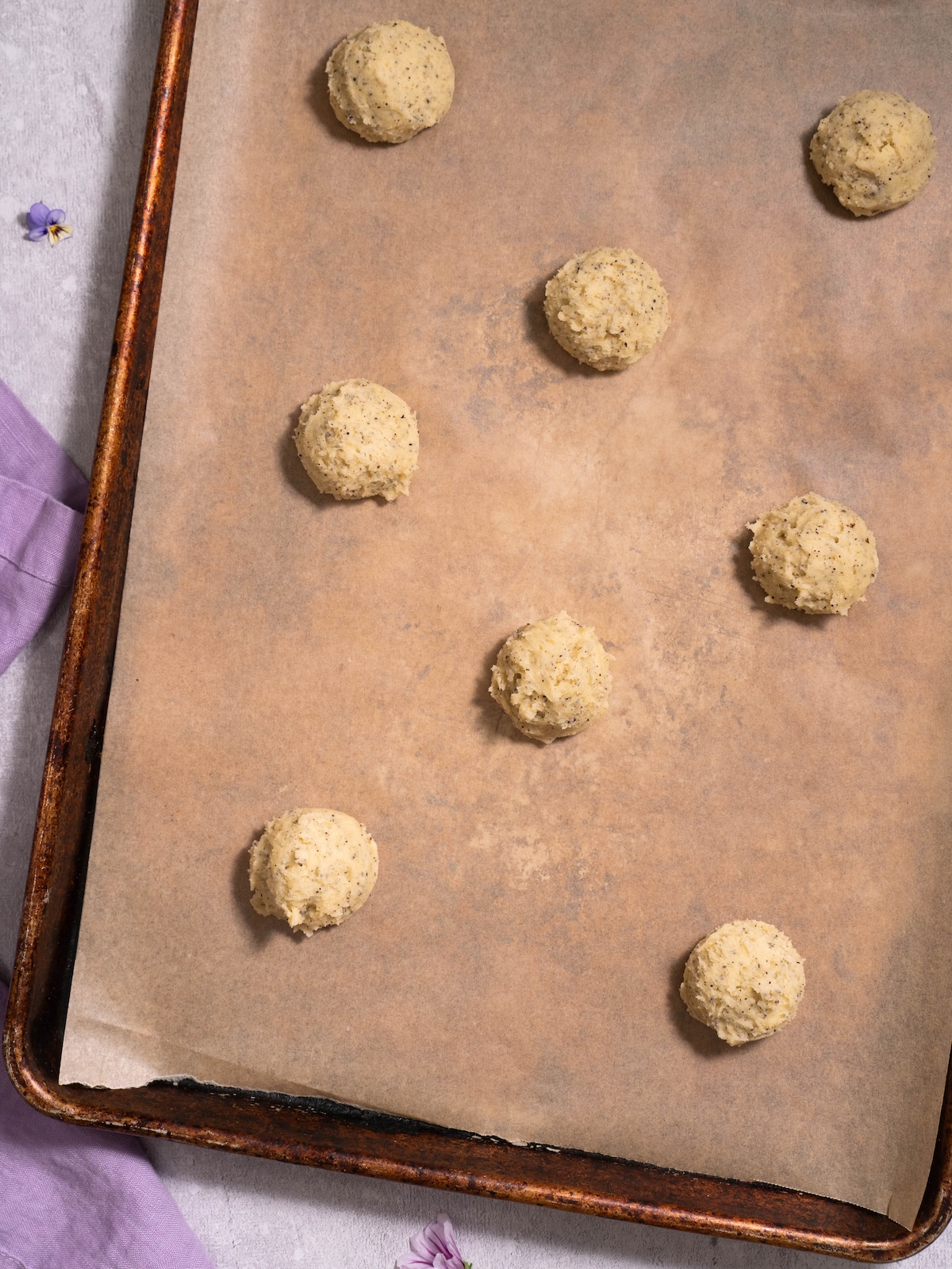 Earl grey cookie dough before baking, scooped into balls