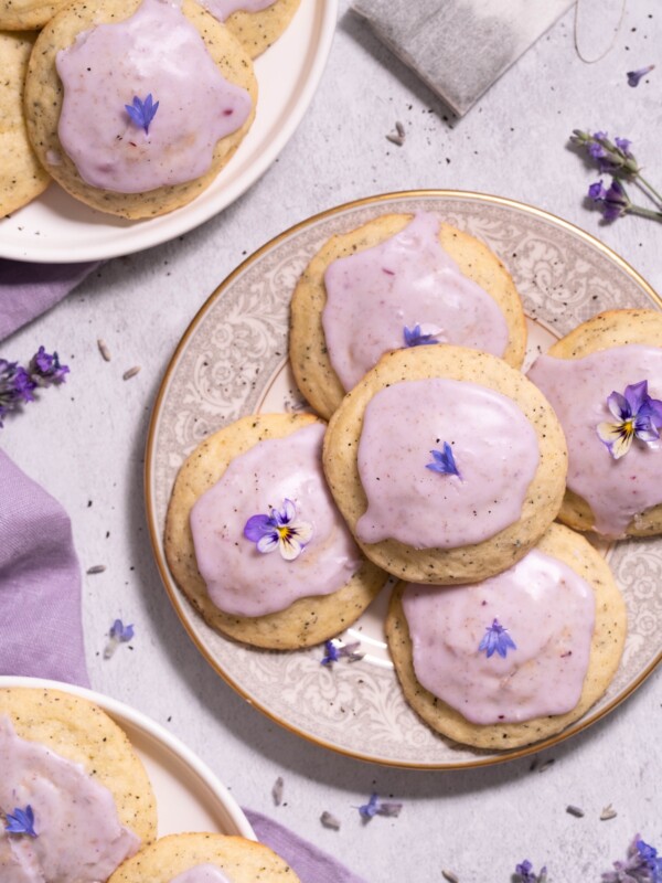 Lavender earl grey cookies with light purple glaze, on little cookie plates