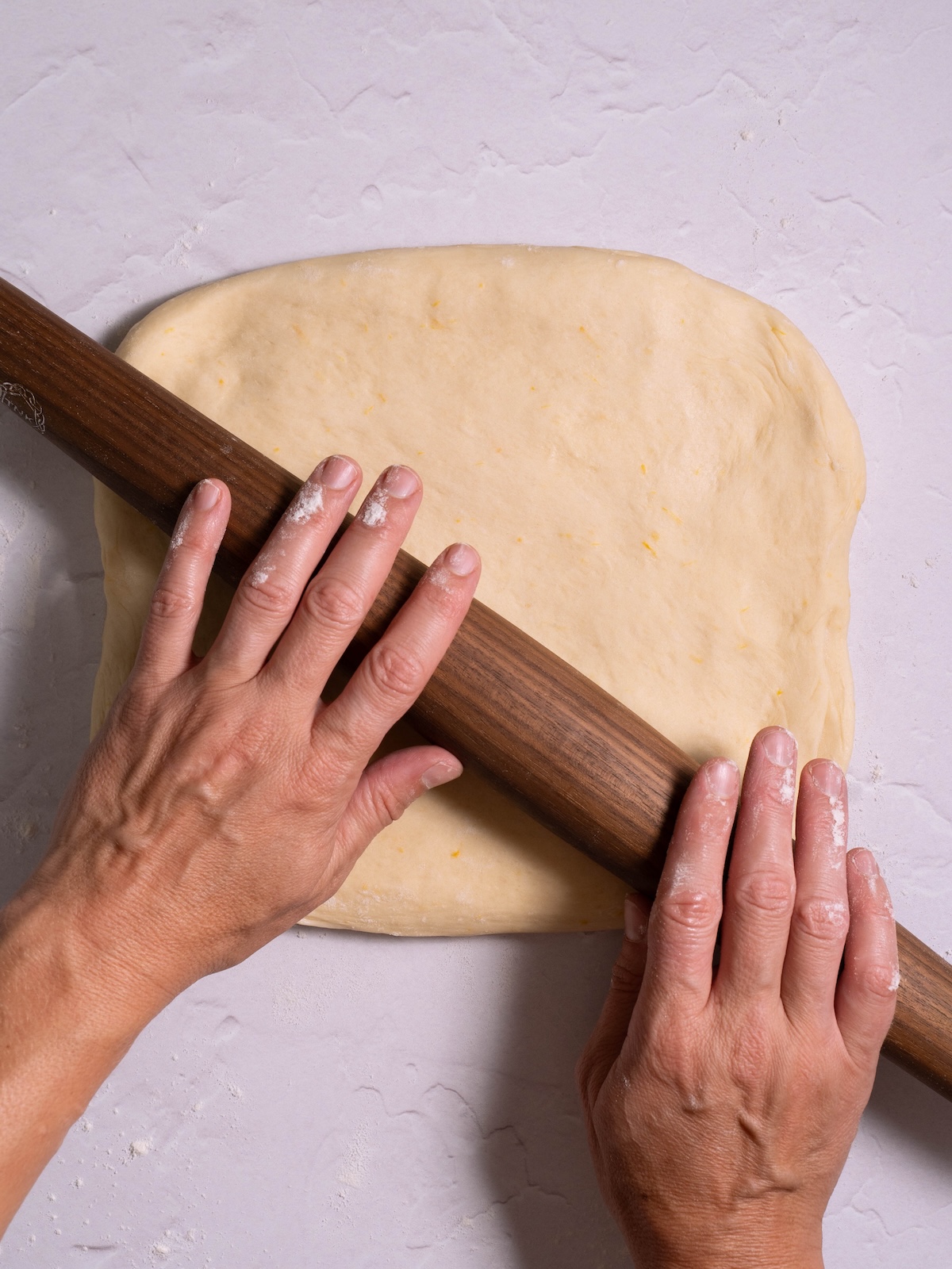 Rolling sweet roll dough into a rectangle