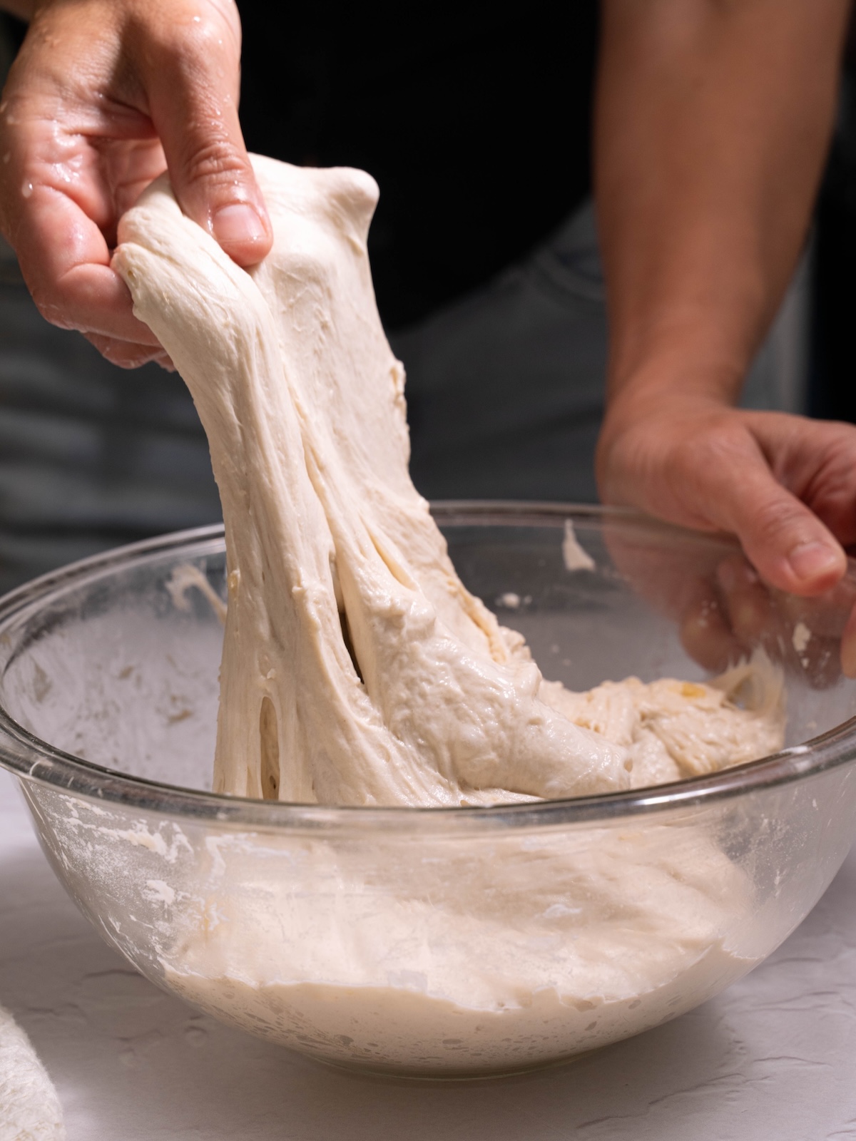 Stretching and folding focaccia dough