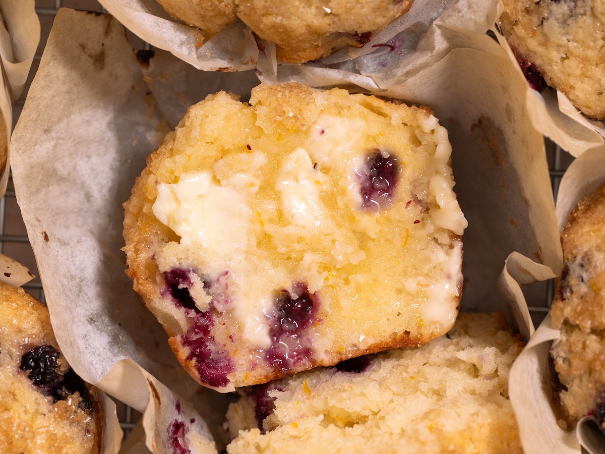 Butter melting onto a warm huckleberry muffin