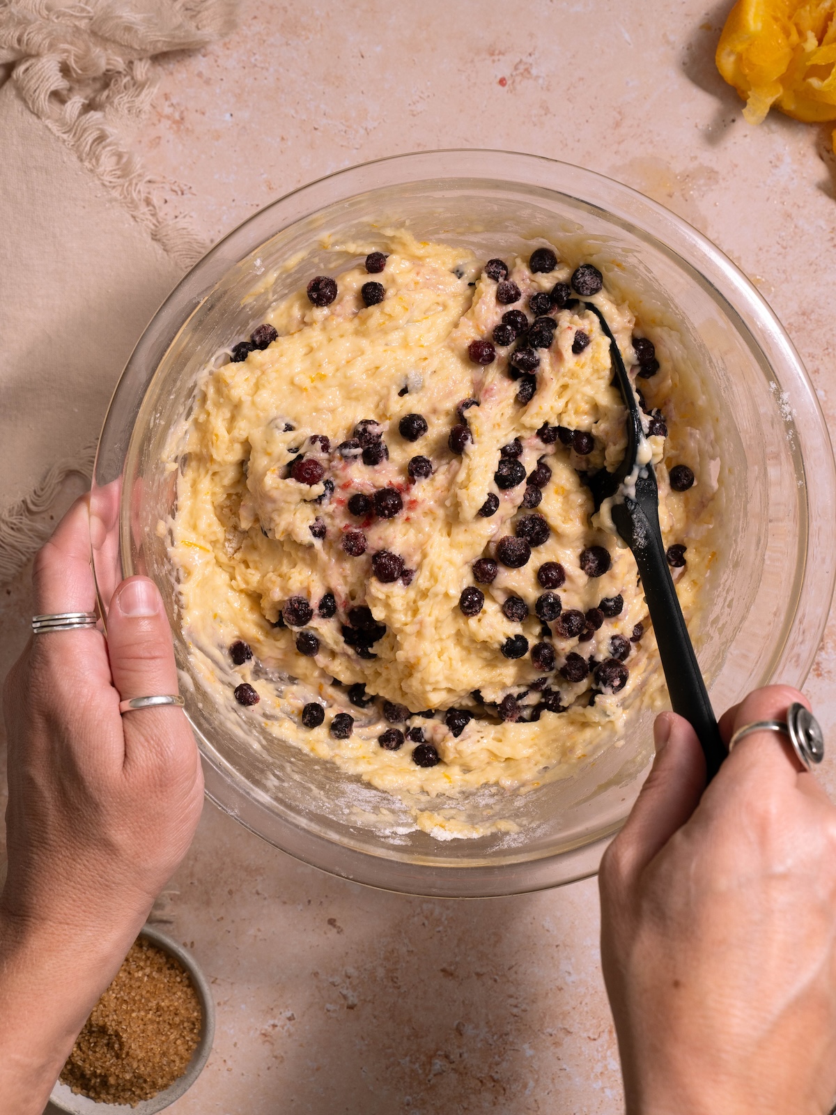 Folding huckleberries into sourdough muffin batter
