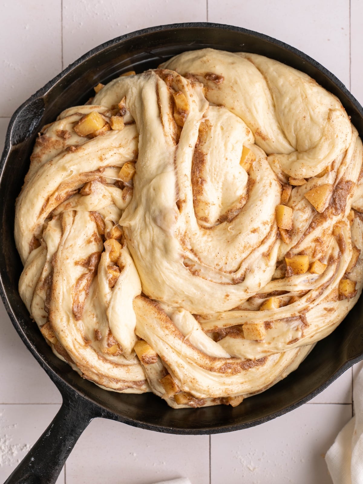 Perfectly proofed sweet roll dough, twisted with cinnamon butter and apples