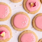 Lemon shortbread cookies covered in pink hawthorn berry glaze