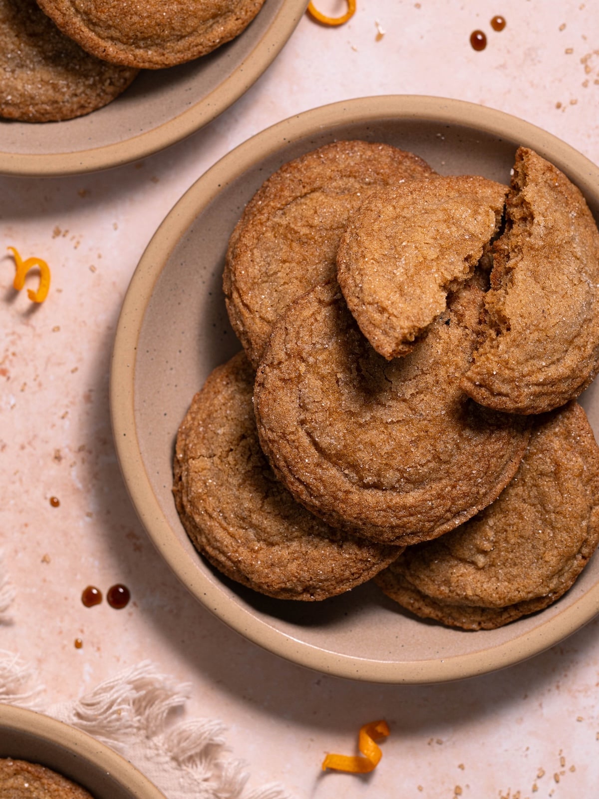 Pine cone molasses crinkle cookies stacked on dessert plates