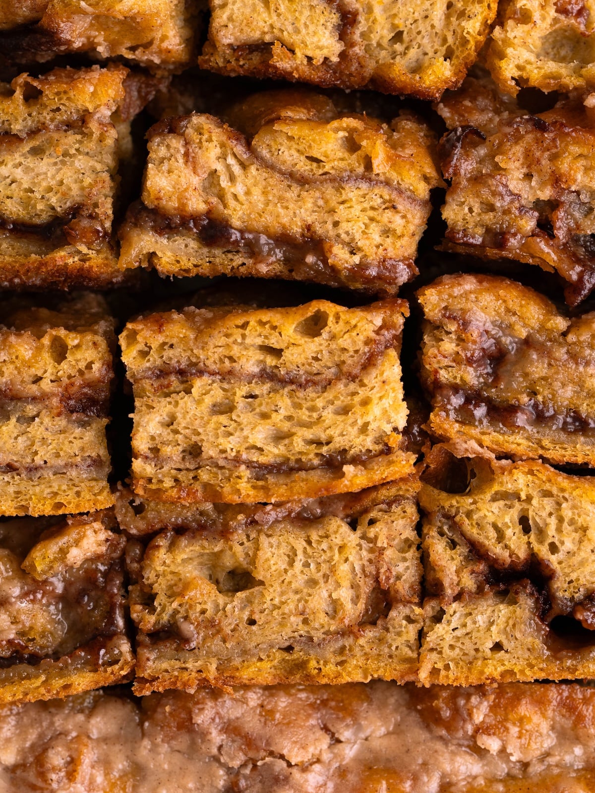Slices of pumpkin spice focaccia with layers of gooey cinnamon sugar