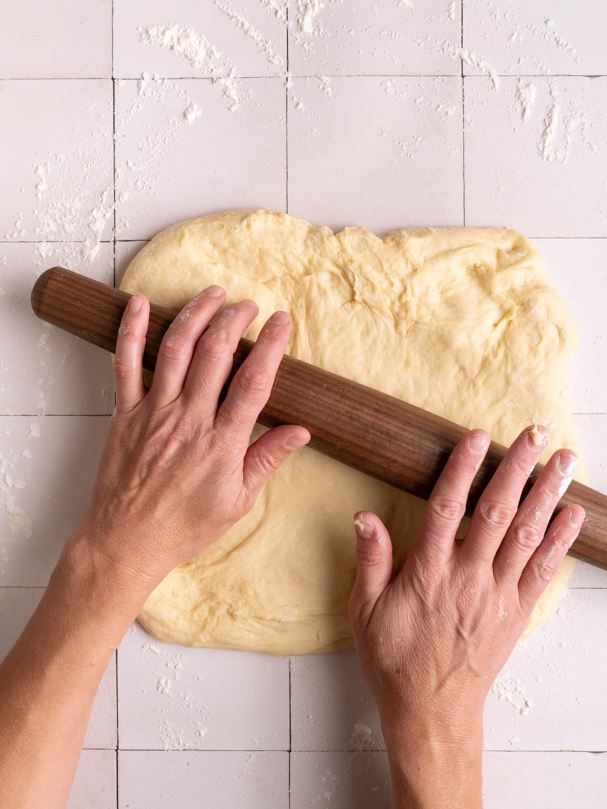 Rolling out sweet roll dough into a rectangle